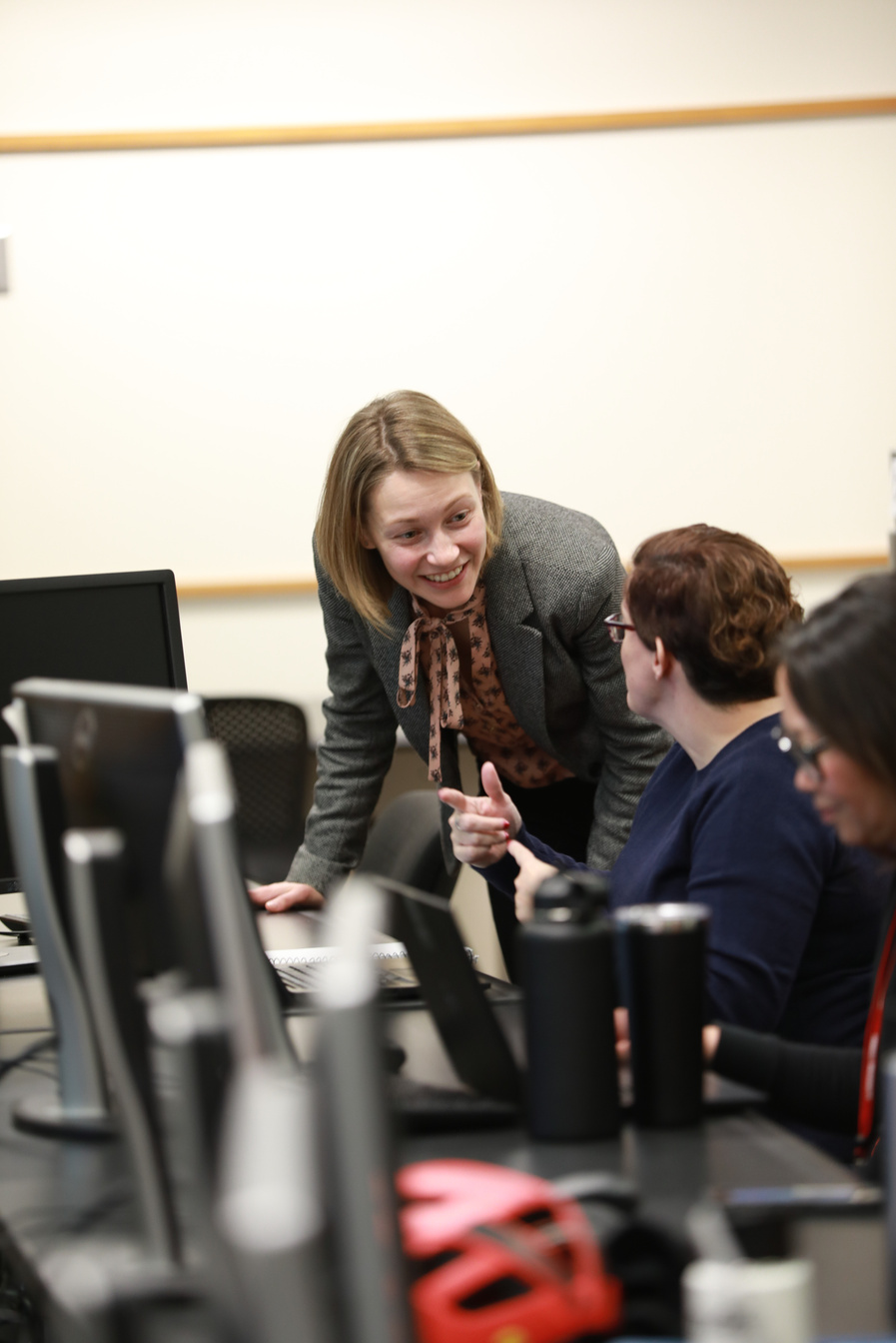 CTI's instructional designer assisting a female Cornell faculty member.