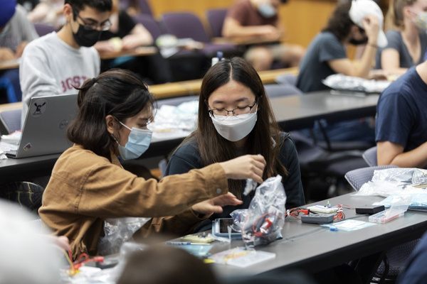 Students in MAE 3780 open their circuit kits.